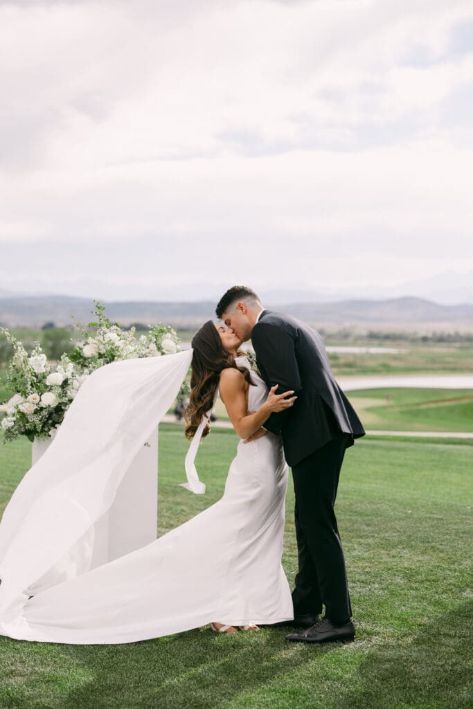 Natalie and Nick share their first kiss as husband and wife at TPC Colorado