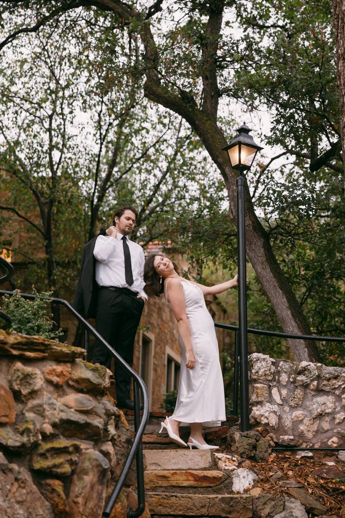 Bridgette laughs as she leans back on the stone steps beside Logan